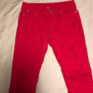 Red distressed skinny jeans by Buzz